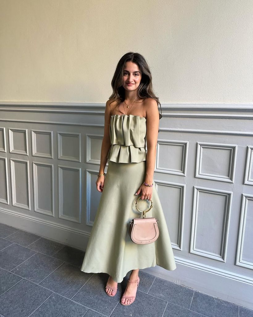 Persheng De Geer in green dress