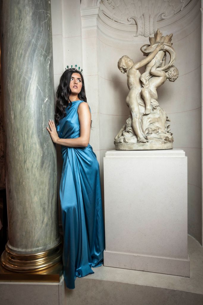 Brunette wears turquoise dress and blue tiara