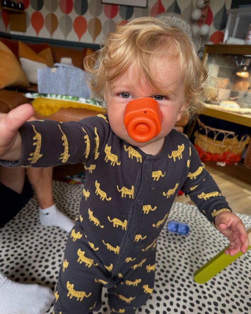 young boy in romper 