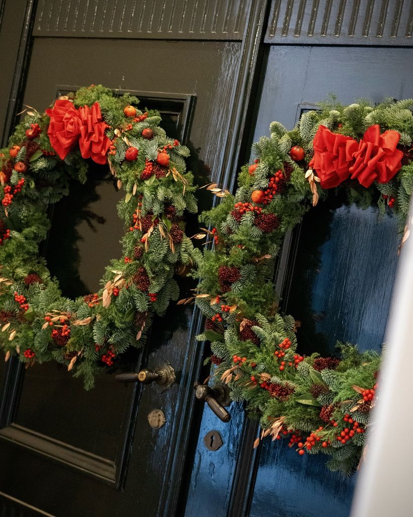 The red themed wreaths inside the Danish royal palace