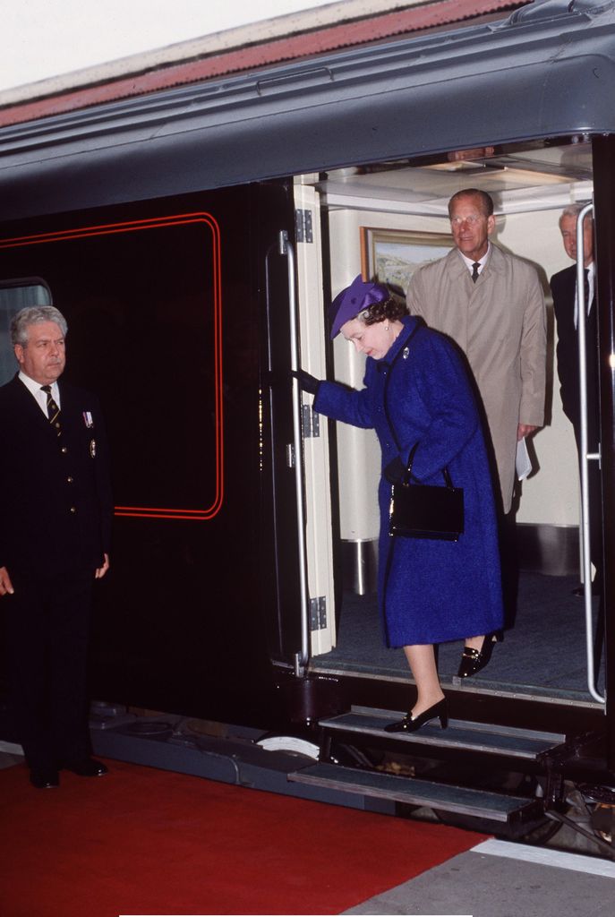 Queen Elizabeth II and Prince Philip disembarking from the royal train
