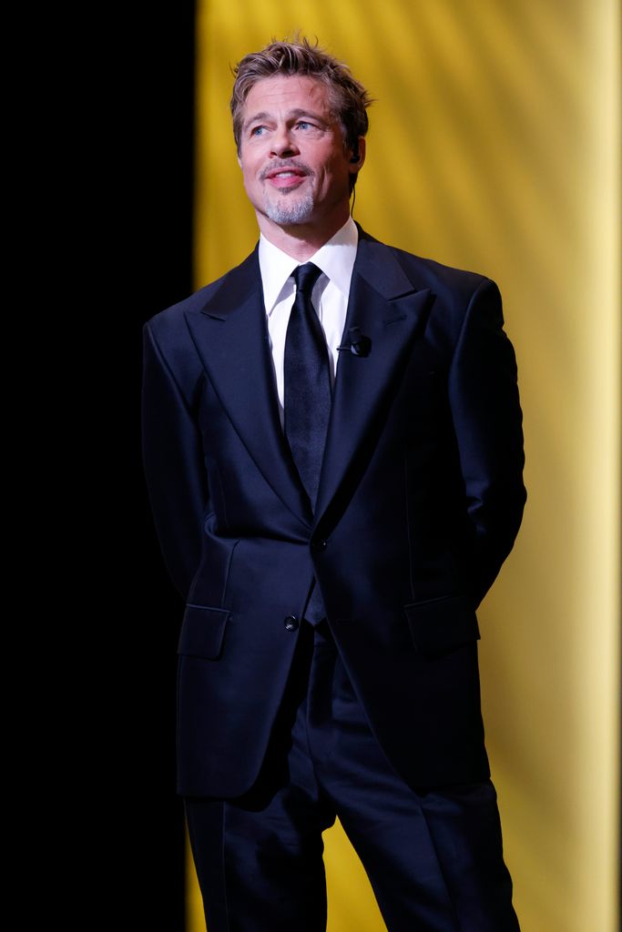 Brad Pitt  onstage while David Fincher receives the "Honorary CÃ©sar Award"  during the 48th Cesar Film Awards at L'Olympia on February 24, 2023 in Paris, France