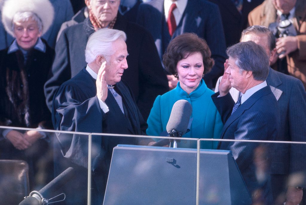 U.S. President Jimmy Carter with wife Rosalynn and Chief Justice Warren E. Burger, taking oath of office of President of the United States from, East Portico of U.S. Capitol, Washington, D.C., USA, Bernard Gotfryd, January 20, 1977