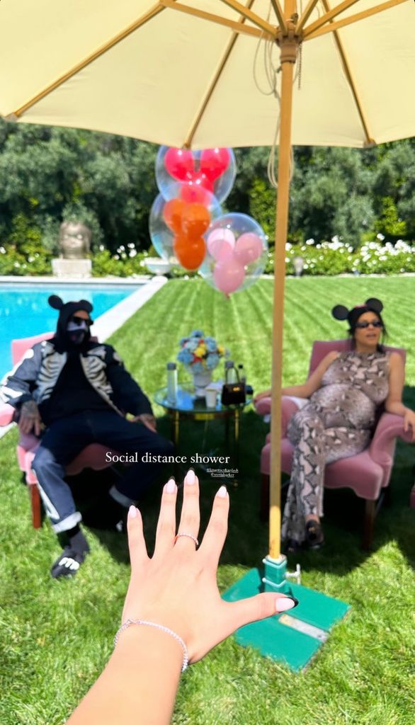 Photo posted by Travis Barker's stepdaughter Atiana de la Hoya from Kourtney Kardashian's baby shower, where the couple is enjoying the festivities socially distanced from guests due to Travis' COVID-19 diagnosis