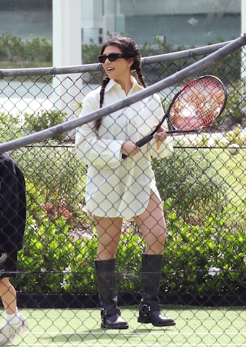 Kourtney wears shirt-dress and black boots while she plays tennis