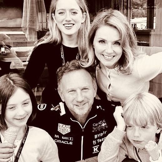 Geri Halliwell and Christian Horner with their three kids in a black and white photo