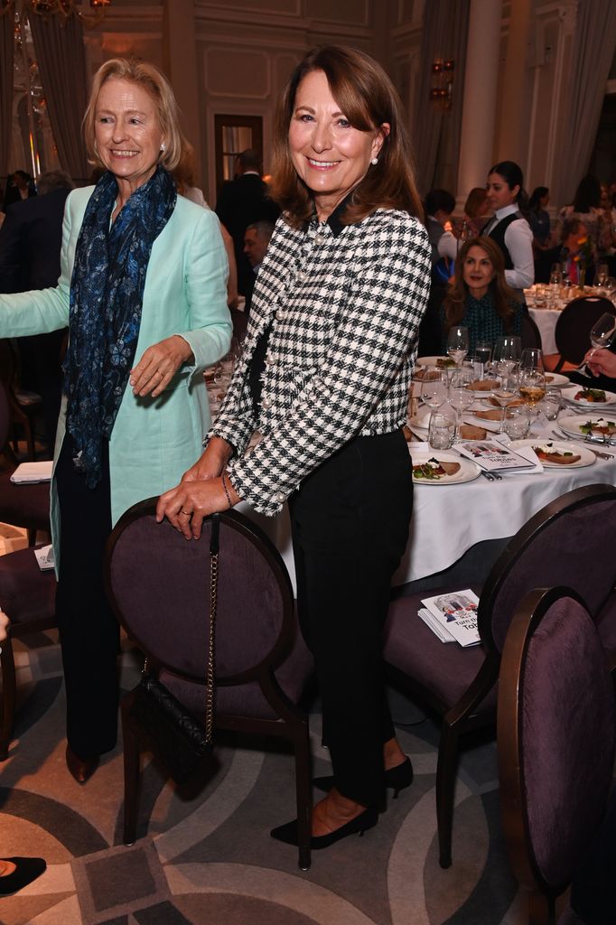 Carole Middleton in a black and white jacket at a dinner table