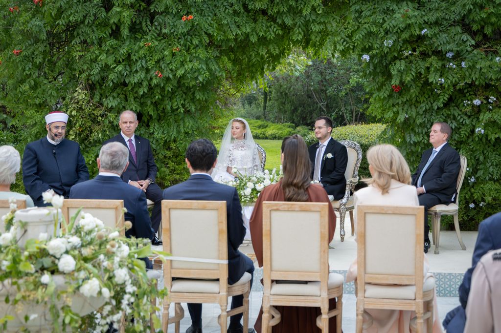 Princess Rajwa Al Hussein, seen wearing a brown dress, also attended the wedding