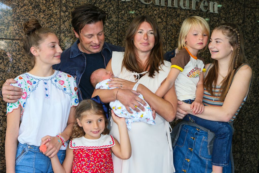 Jamie and Jools Oliver with their five children after welcoming River. 