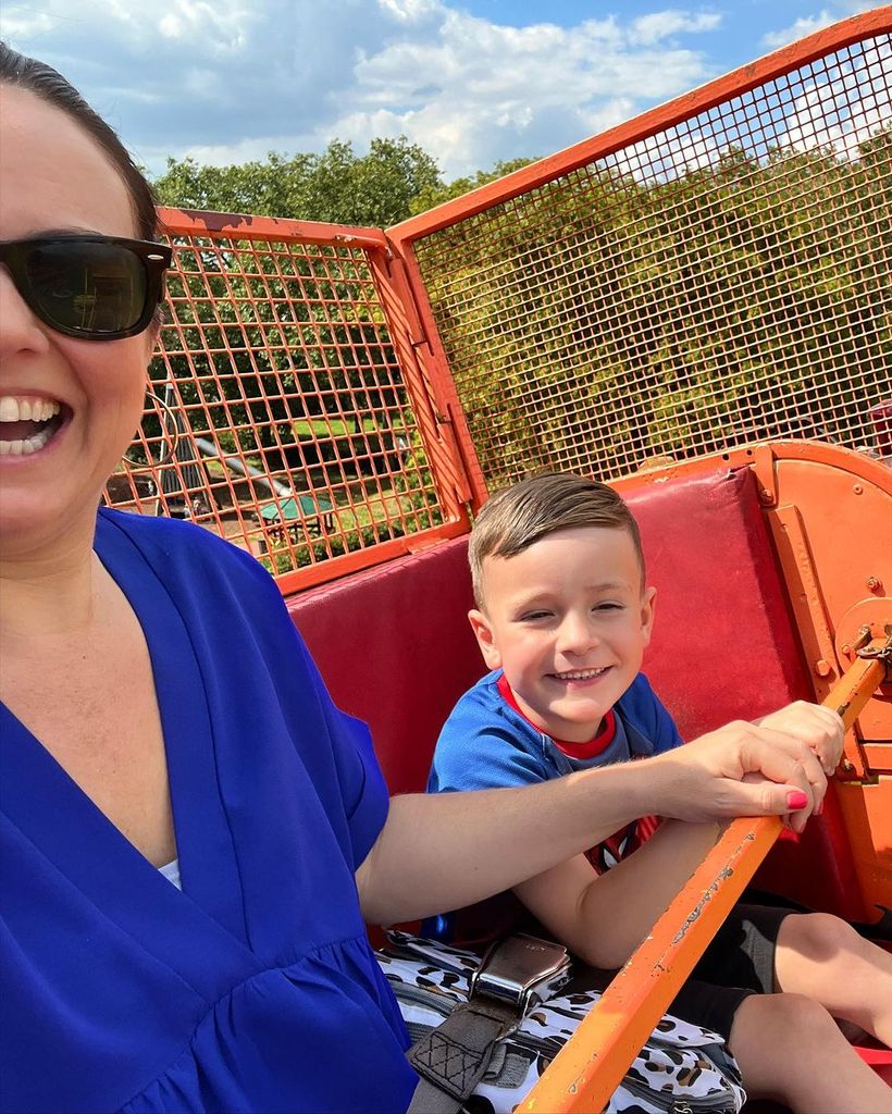 nina on ride with son 