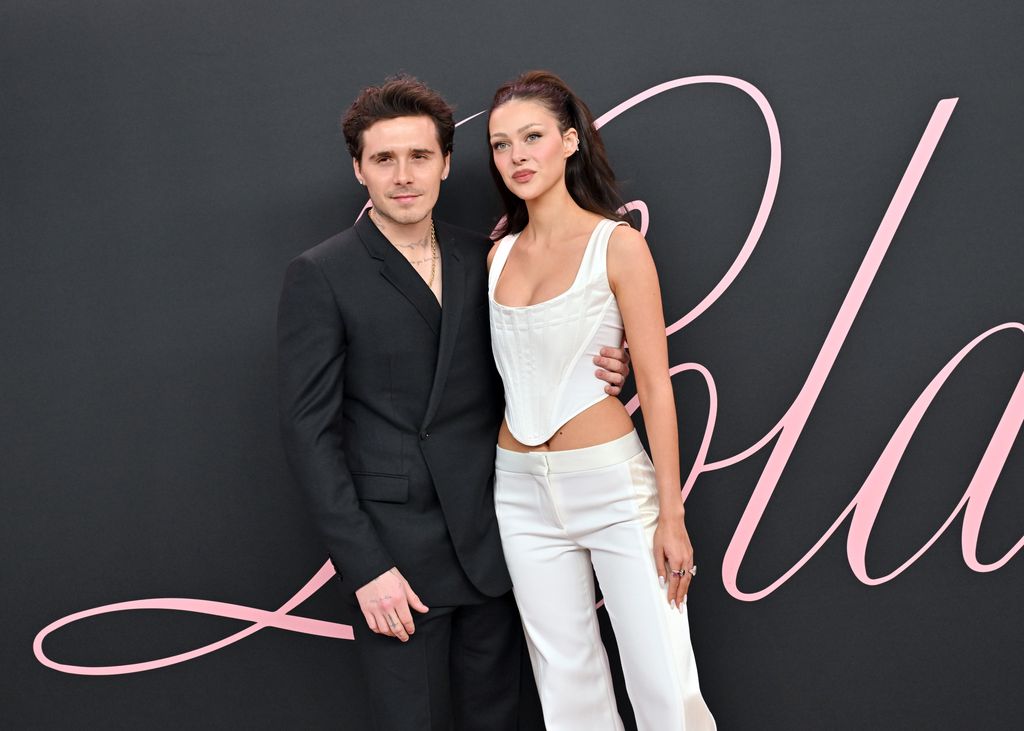 Brooklyn Beckham with his arm around Nicola Peltz
