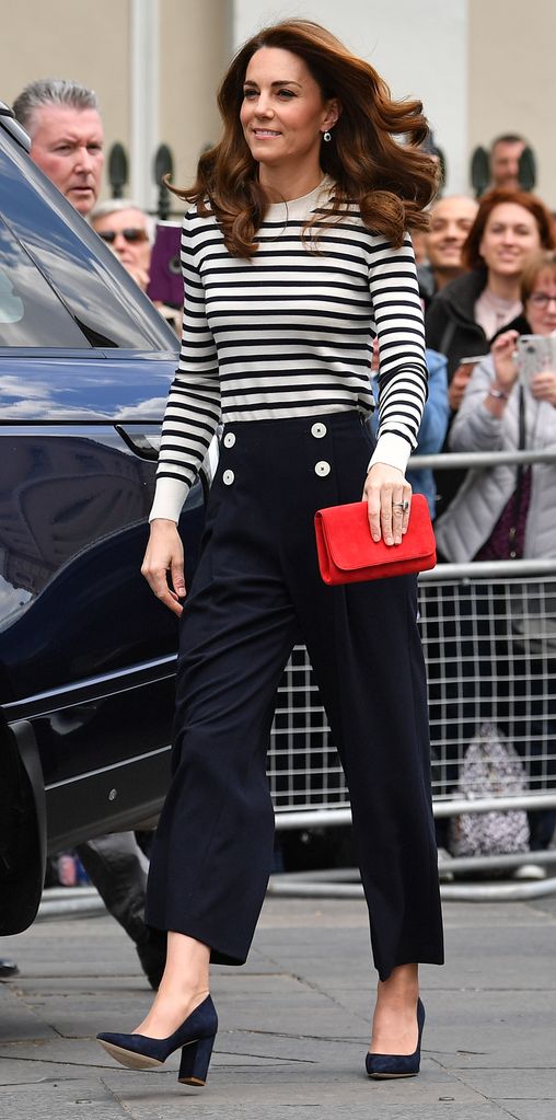 Princess Kate wears navy heels, navy trousers and a Breton sweater