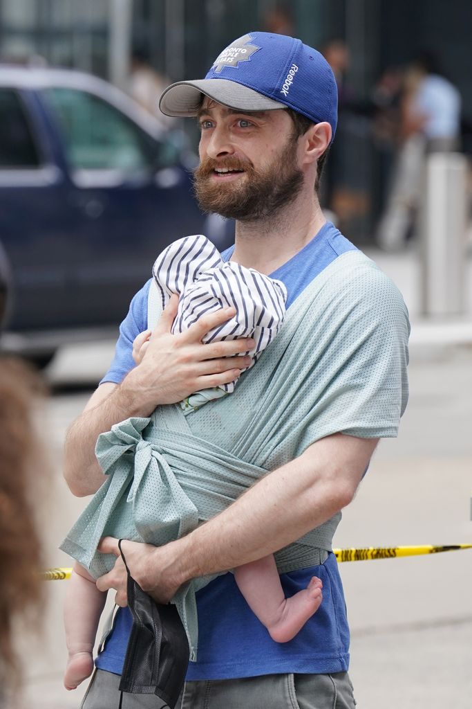 Daniel Radcliffe holding son on picket line