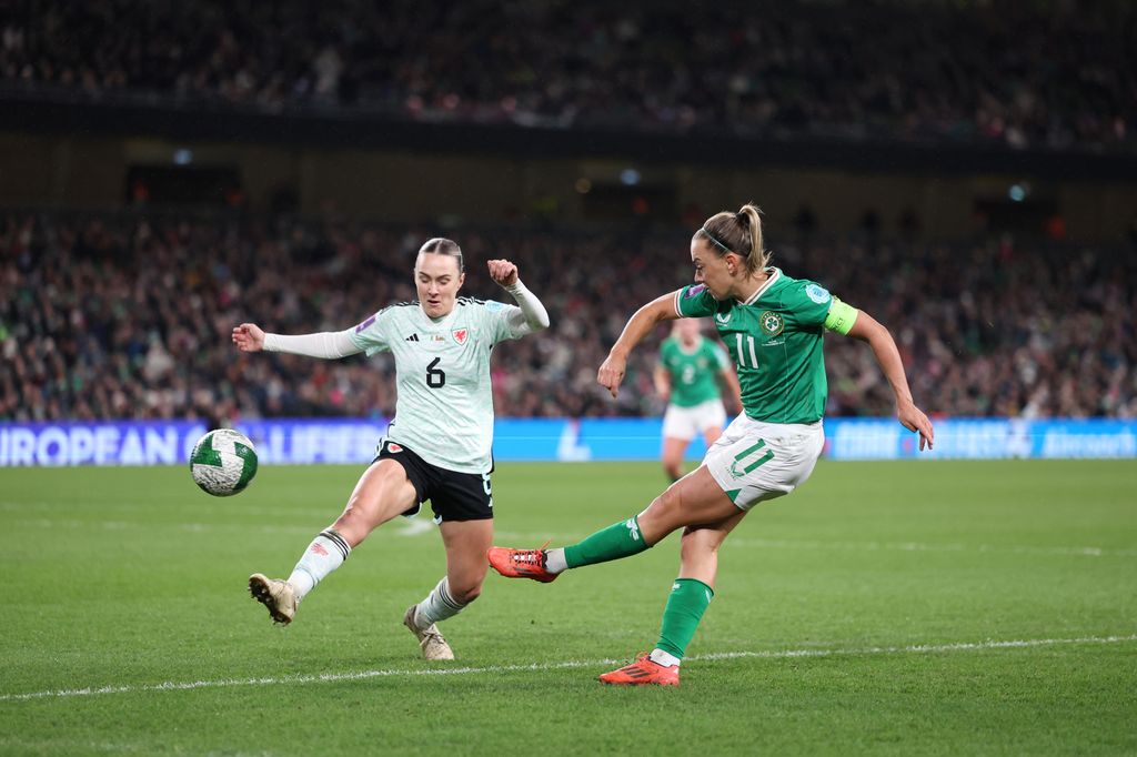 Josie Green kicking football with katie mccabe