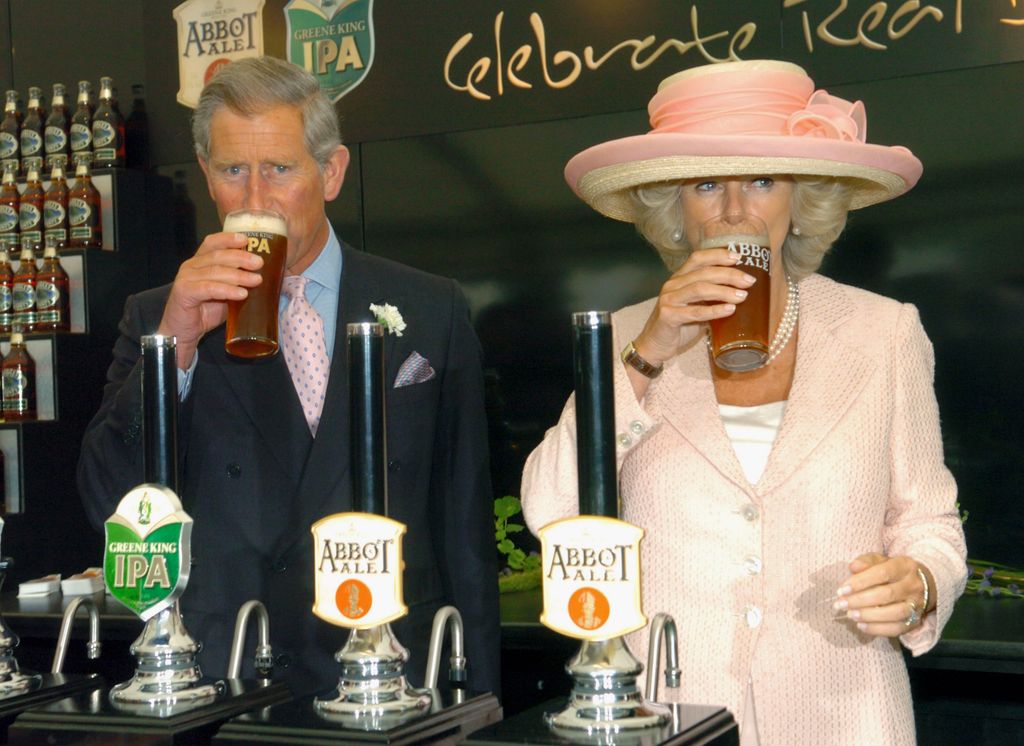 King Charles and Queen Camilla sipping beer