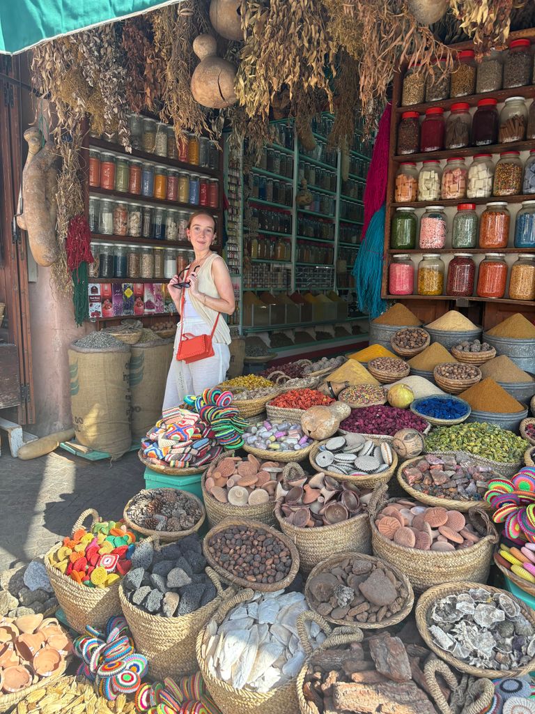 A girl standing at one of the Souk market stalls