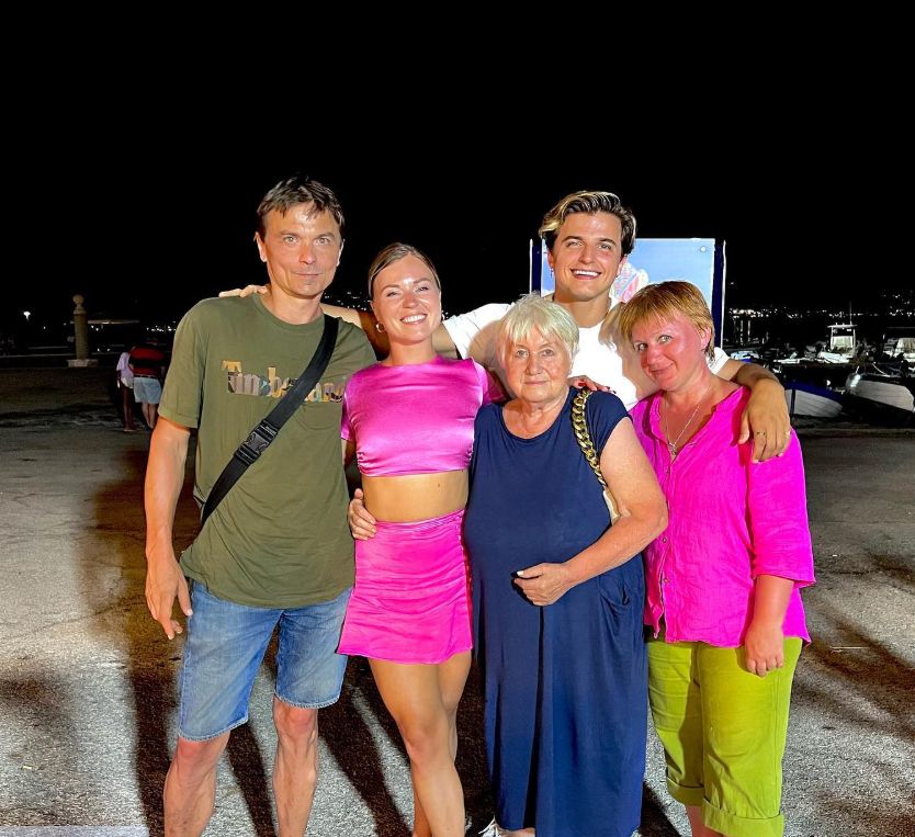 Nikitz Kuzmin on a jetty with his parents, sister and grandmother
