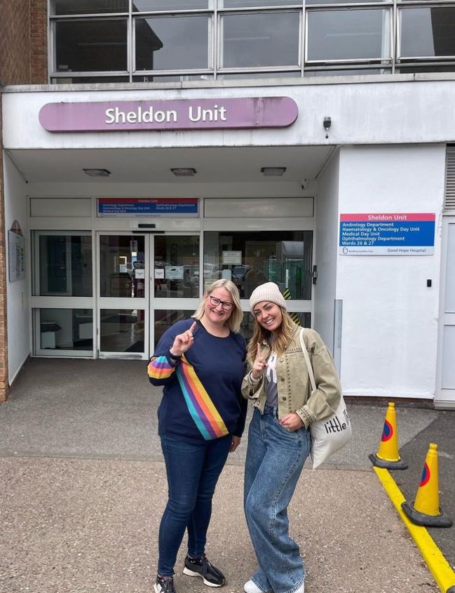 A woman and Amy Dowden standing together outside a hospital