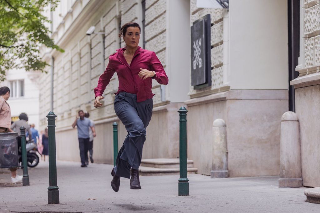 woman running through street