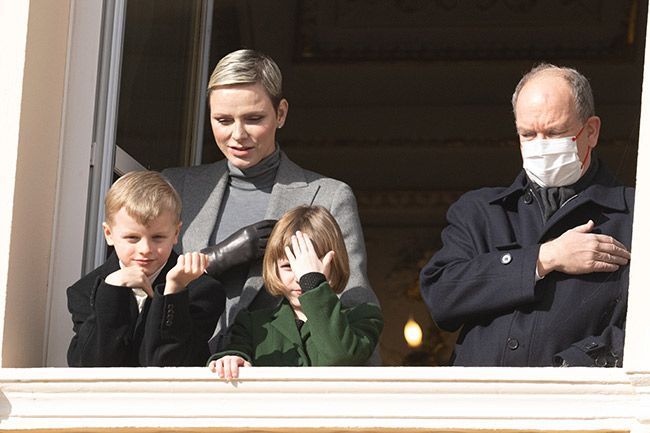 Princess Charlene with her twins alongside Prince Albert who is wearing a mask
