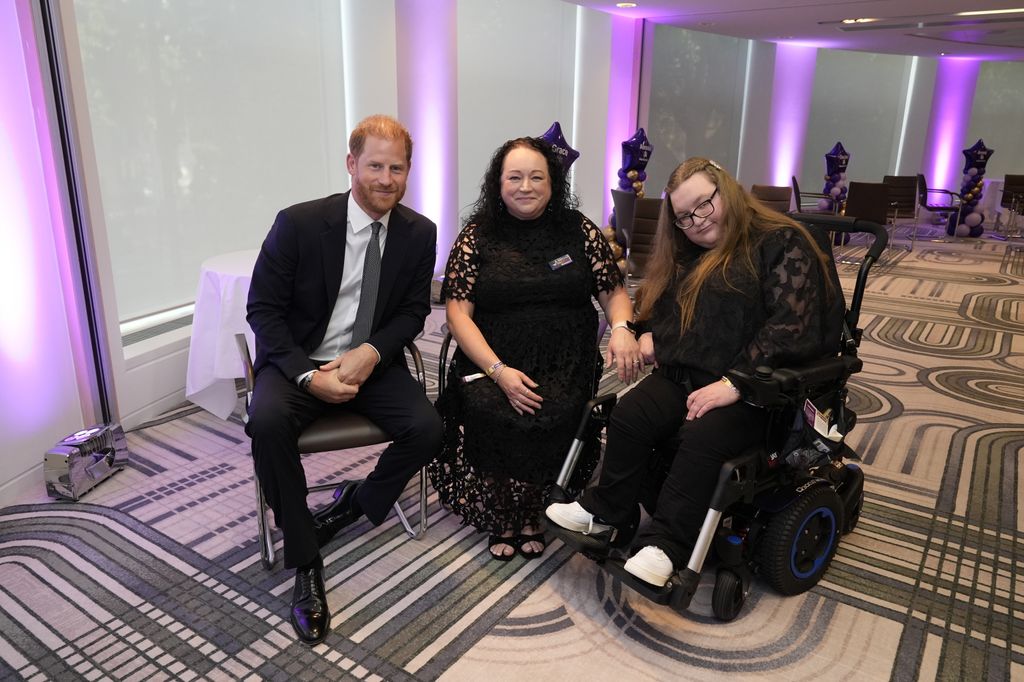 Harry with Mandy (centre), the recipient of the Parent Carer award, and her daughter Grace 