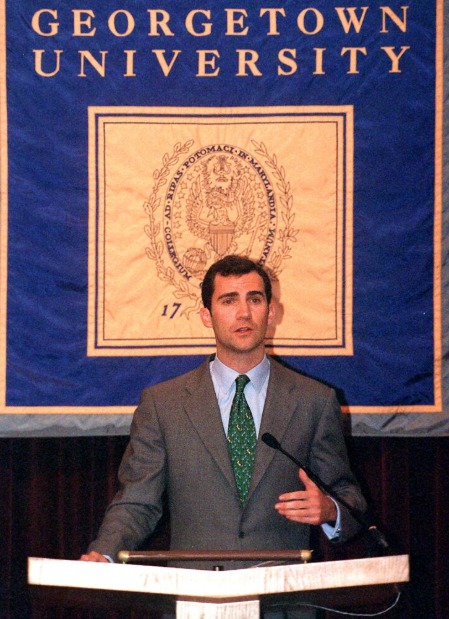 King Felipe speaking at a podium at Georgetown University