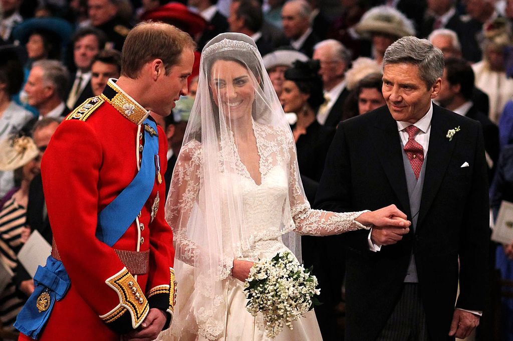 William speaking to Kate next to Michael Middleton at royal wedding