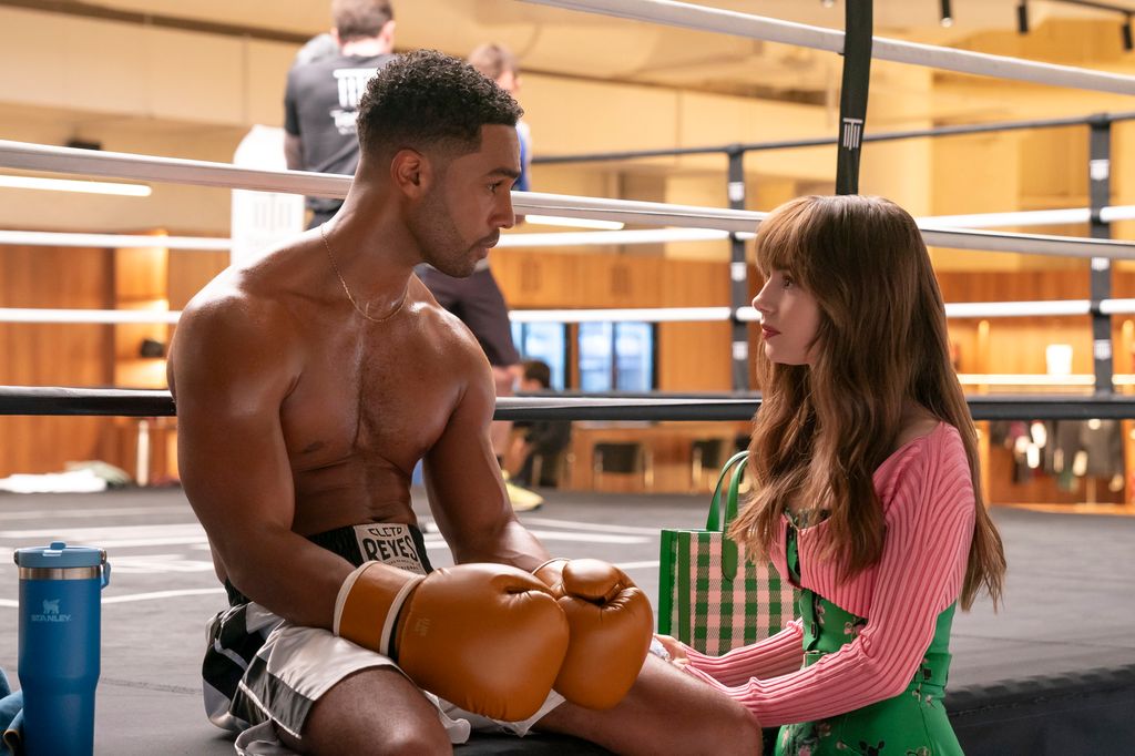 A shirtless Lucien Laviscount sat with Lily Collins