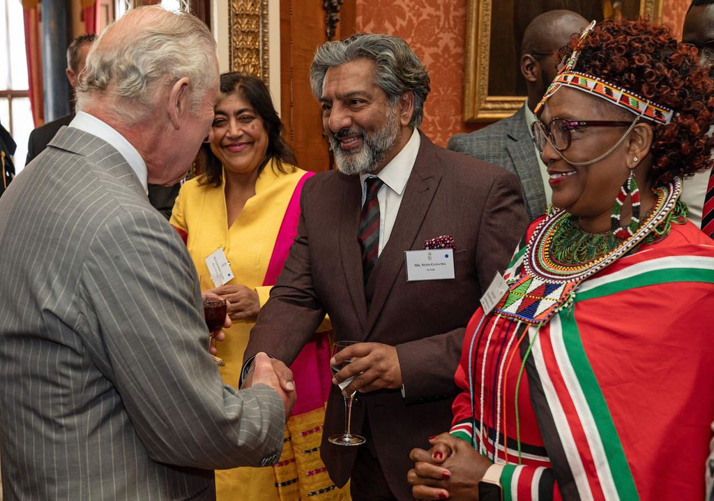 King Charles meets film director Gurinda Chadha (L), actor Nitan Ganatra, and Islington and Dagenham councillor Elizabeth Kangethe