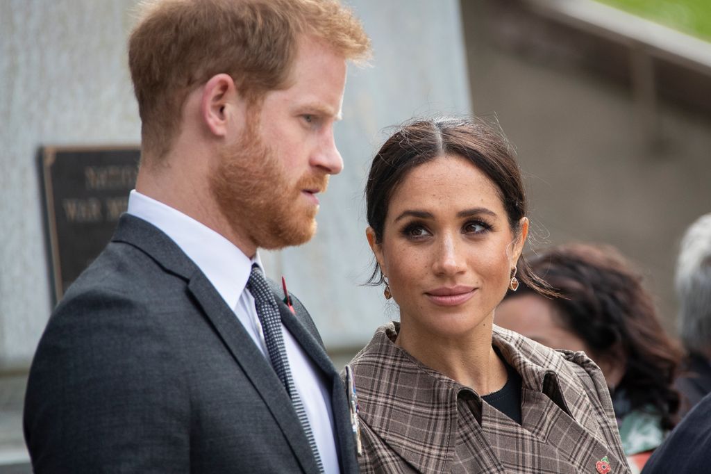 Prince Harry, Duke of Sussex and Meghan, Duchess of Sussex lay ferns and a wreath at the tomb of the Unknown Warrior at the newly unveiled UK war memorial and Pukeahu National War Memorial Park, on October 28, 2018, in Wellington, New Zealand. The Duke and Duchess of Sussex are on their official 16-day Autumn tour visiting cities in Australia, Fiji, Tonga and New Zealand. (Photo by Rosa Woods - Pool/Getty Images)