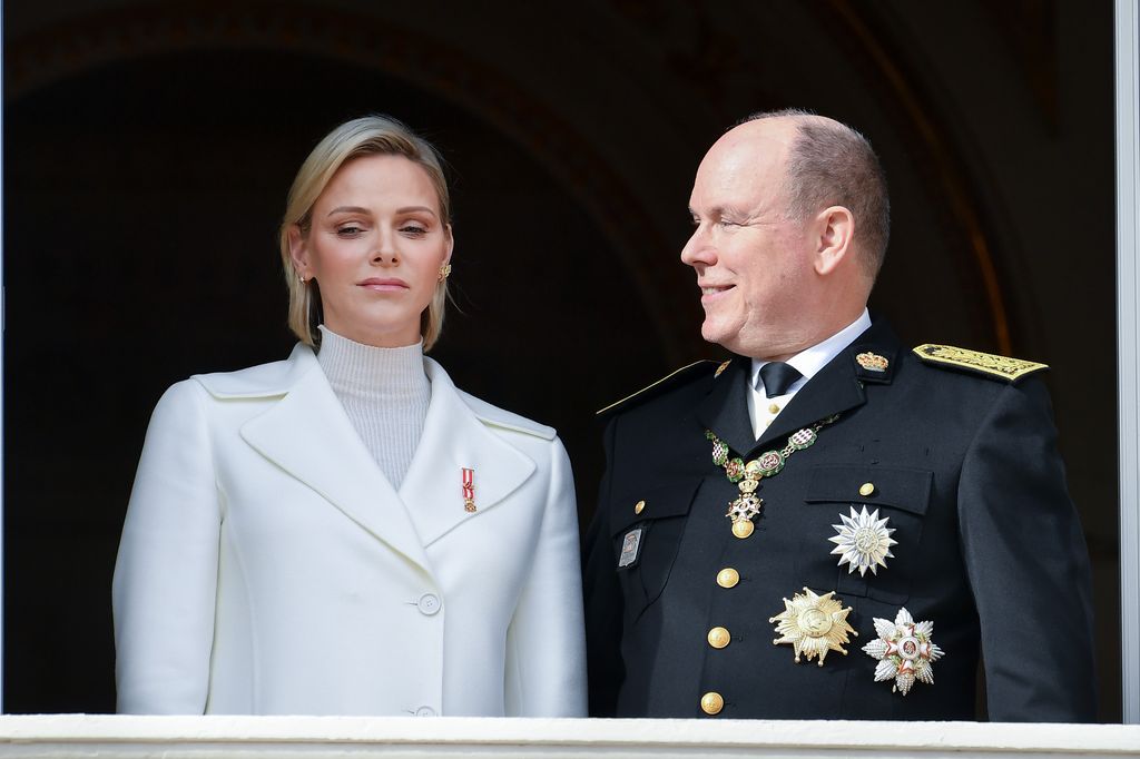   Princess Charlene of Monaco and Prince Albert II of Monaco pose at the Palace balcony during the Monaco National Day Celebrations 