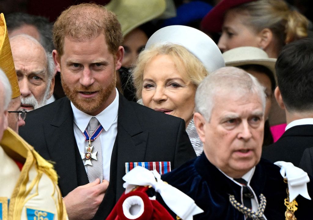 Britain's Prince Harry, Duke of Sussex (L) and Britain's Prince Andrew, Duke of York (R) leave after attending the coronations of Britain's King Charles III and Britain's Camilla, Queen Consort