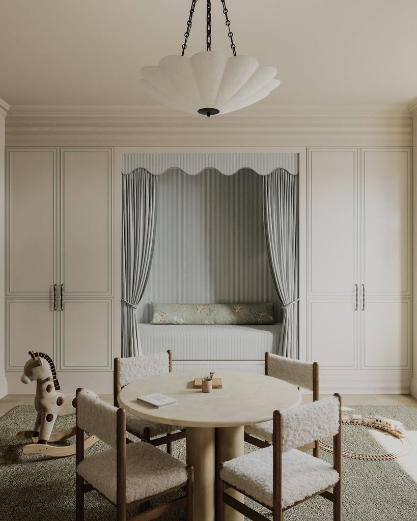 children's room with wardrobes and table and chairs