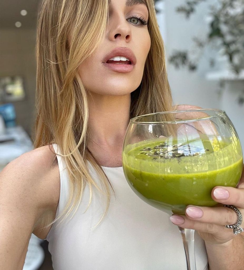 Abbey holding green smoothie