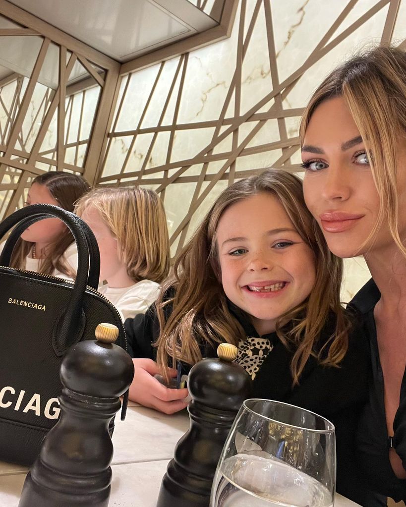 Abbey Clancy posing with daughter Liberty Rose