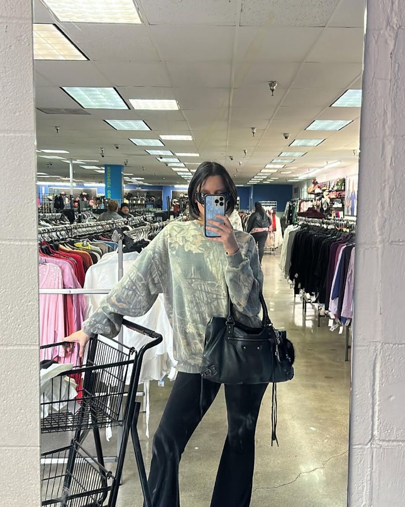 women in trackies and designer bag