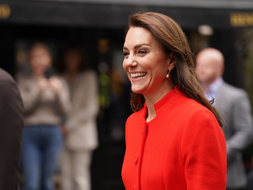 Kate Middleton wearing a red coat