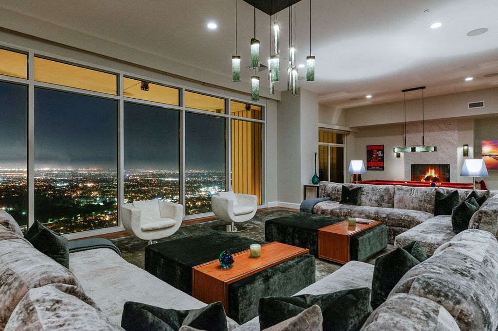 Rihanna has put her luxury LA penthouse at The Century skyscraper - formerly owned by Matthew Perry - back on the market for $25 million just a year after buying it. Pictured: living room.