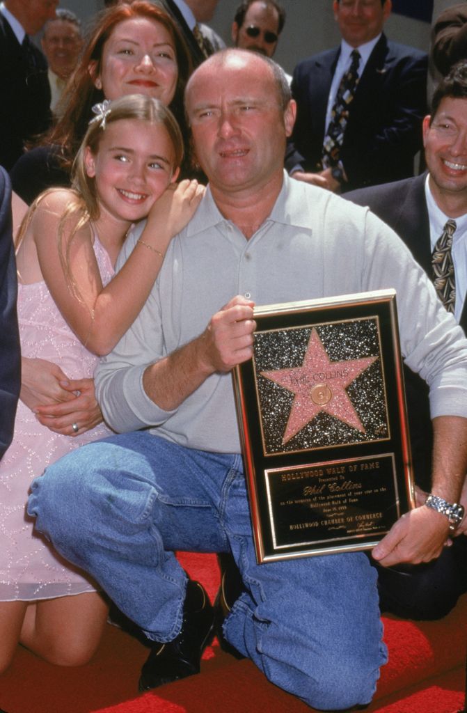 British musician Phil Collins poses with his daughter Lily