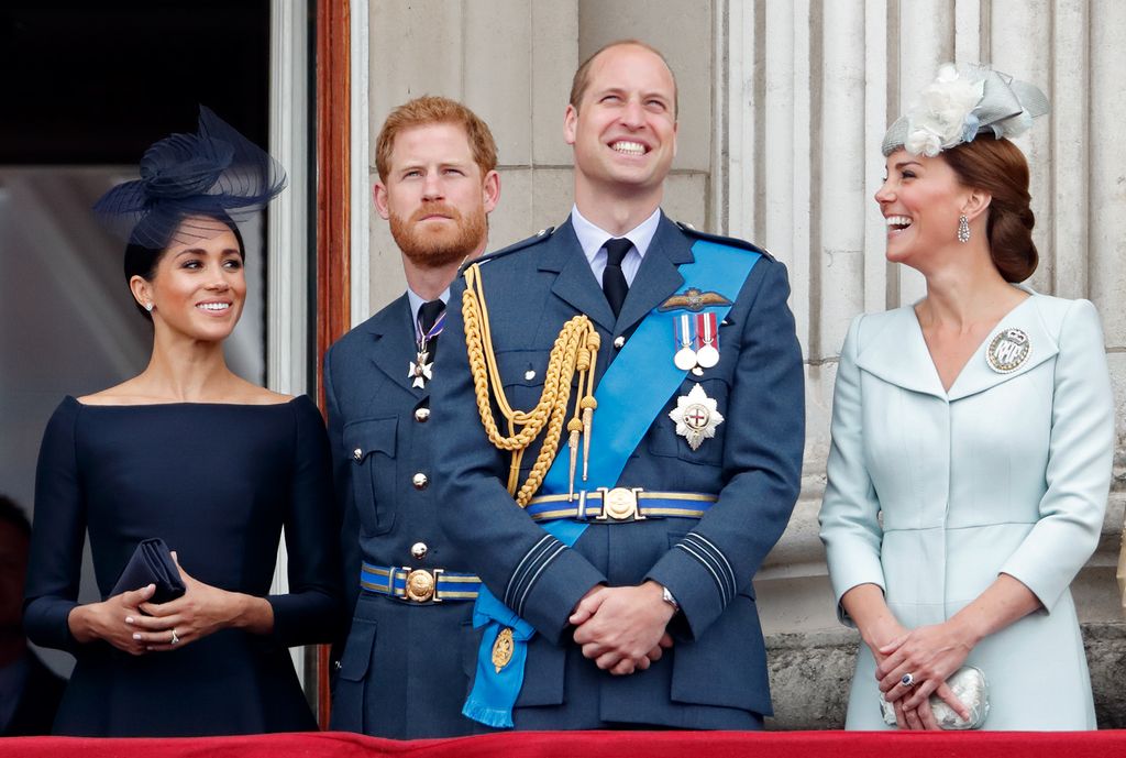 Meghan, Duchess of Sussex, Prince Harry, Duke of Sussex, Prince William, Duke of Cambridge and Catherine, Duchess of Cambridge watch a flypast to mark the centenary of the Royal Air Force from the balcony of Buckingham Palace on July 10, 2018 in London, England.
