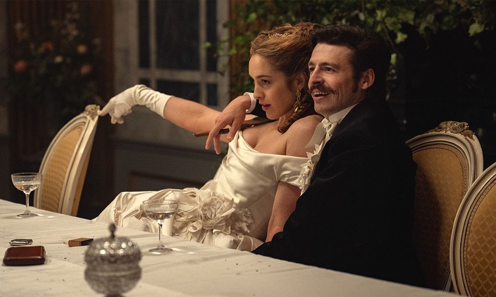 man and woman sitting at dinner table