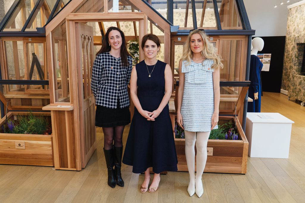 Princess Eugenie standing with two women
