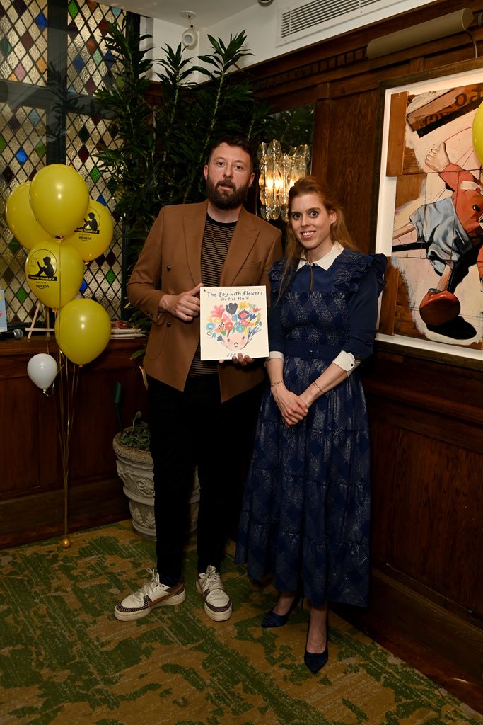 Jarvis and Princess Beatrice posing together with his winning book