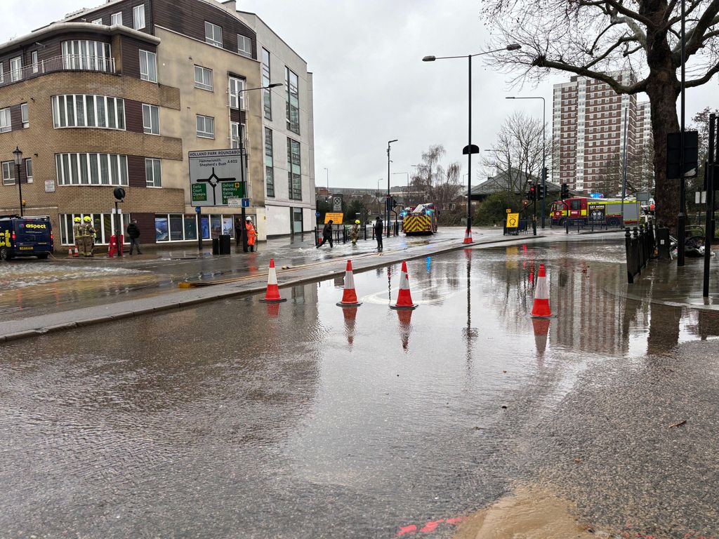 Fire crews from London Fire Brigade respond to widespread surface flooding on and around the Shepherd's Bush roundabout and Holland Park Avenue