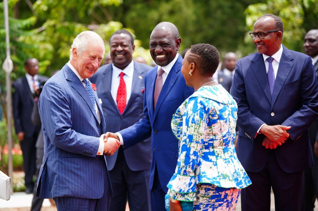 The King was all smiles as he shook hands with Kenyan President William Ruto 