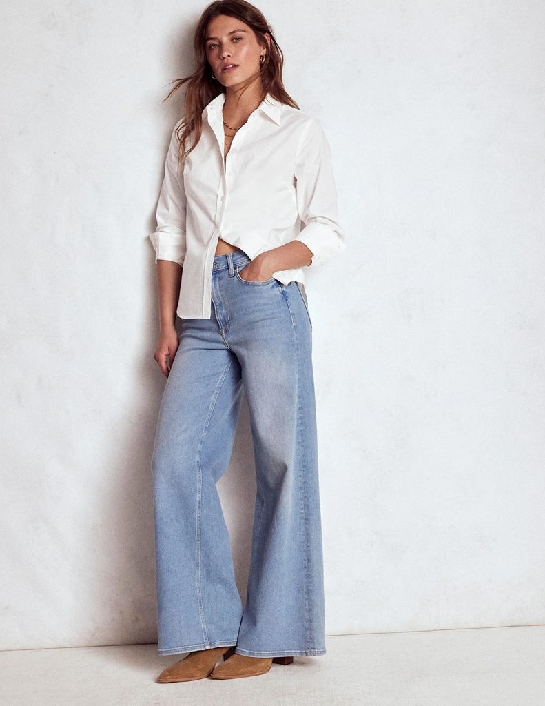 model in jeans and white shirt