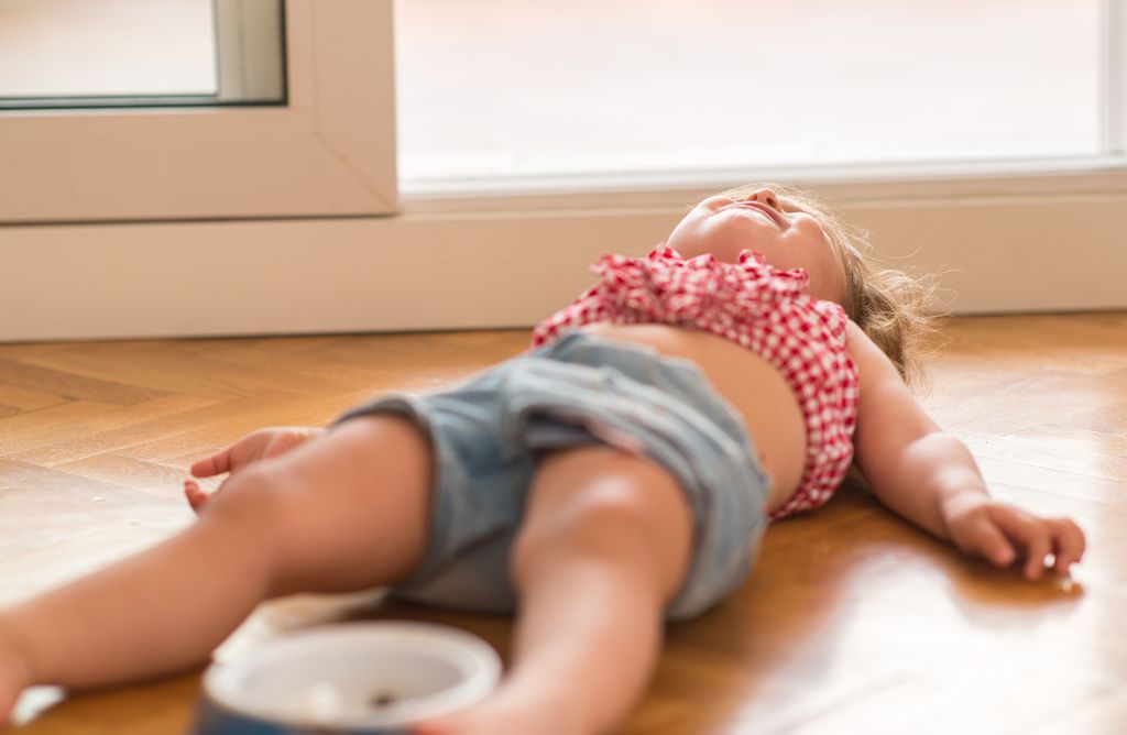 Baby toddler having tantrum on floor