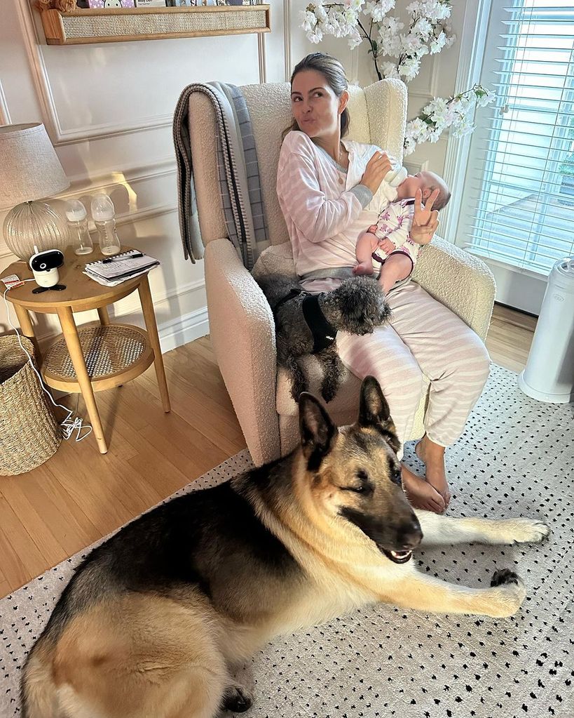 Maria at home with her baby girl