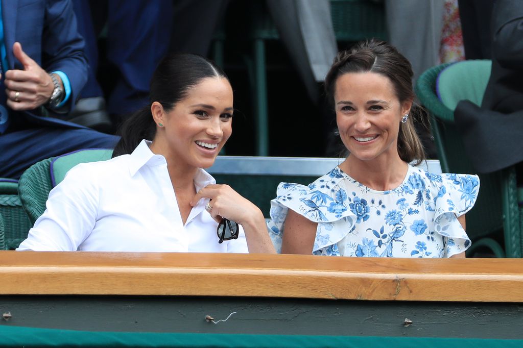 Meghan, Duchess of Sussex (L) jokes with Pippa Matthews in the Royal Box on Centre Court on Day 12 of The Championships - Wimbledon 2019 at the All England Lawn Tennis and Croquet Club on July 13, 2019 in London, England.