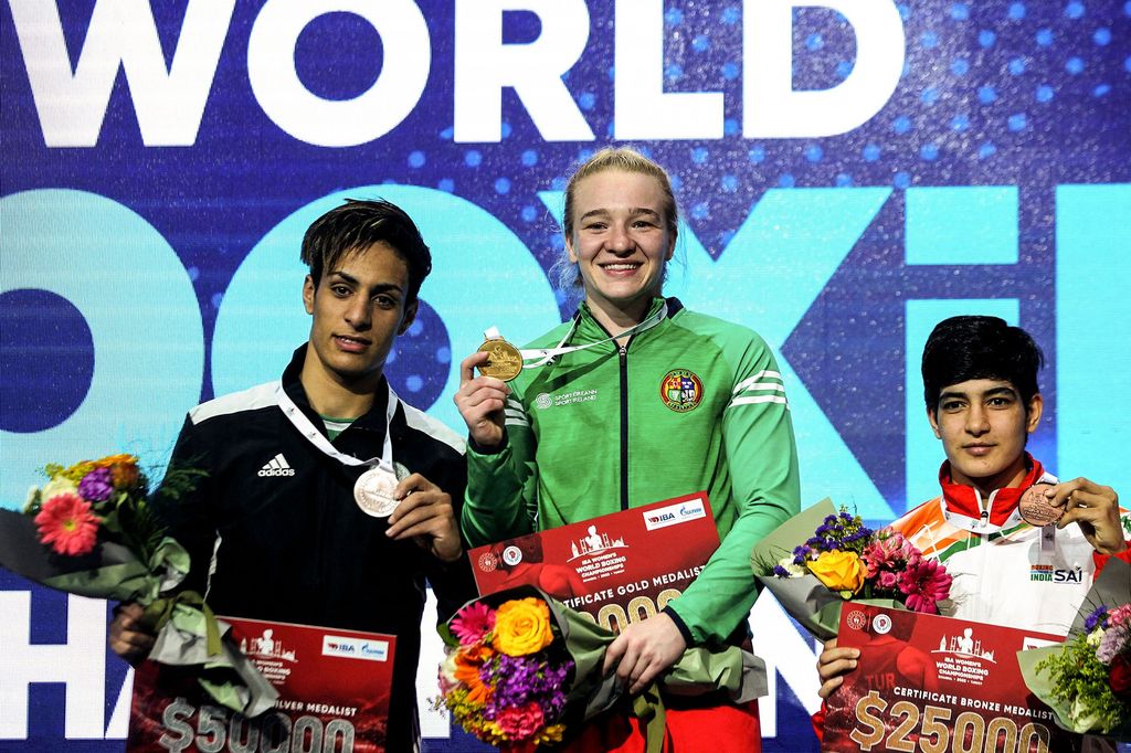 Imane Khelif with a silver medal alongside Amy Broadhurst and Parveen